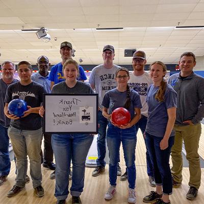 members of the agribusiness club pose for a photo at a bowling event